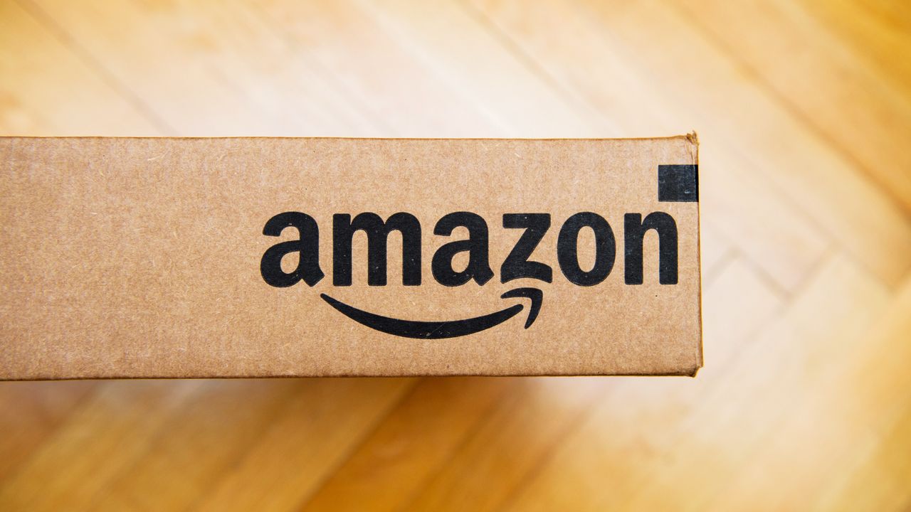 Amazon logo printed on side of a cardboard box