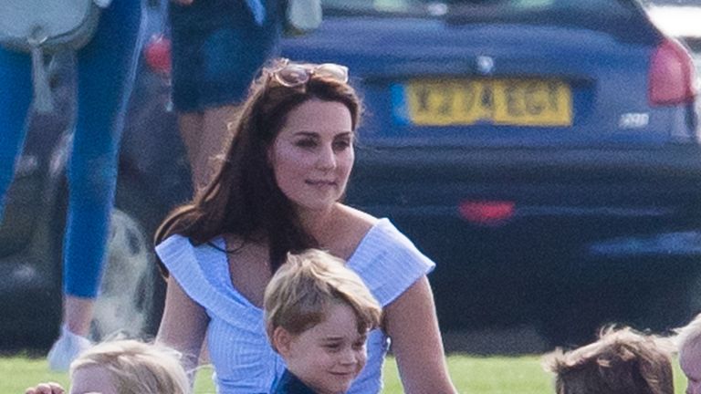 gloucester, england june 10 catherine, duchess of cambridge looks on as prince george of cambridge holds a toy gun the maserati royal charity polo trophy at beaufort park on june 10, 2018 in gloucester, england photo by samir husseinwireimage