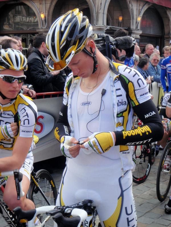 Mark Renshaw (HTC-Columbia) makes some adjustments to his radio
