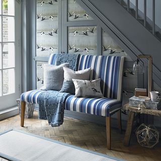 blue hallway with bench and cushions