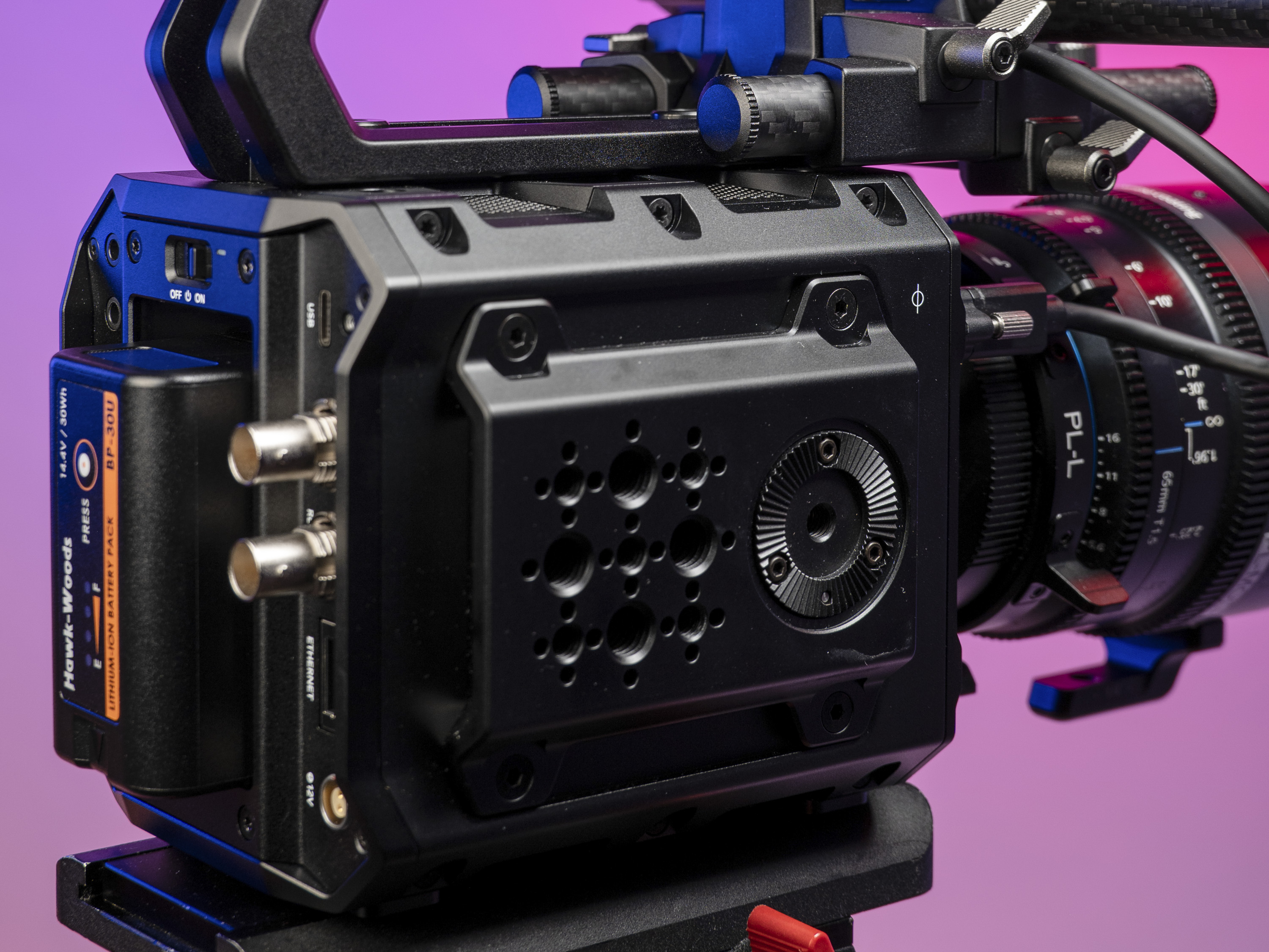 Closeup of the Blackmagic Pyxis 6K camera's I/O options, in the studio with a vibrant magenta background