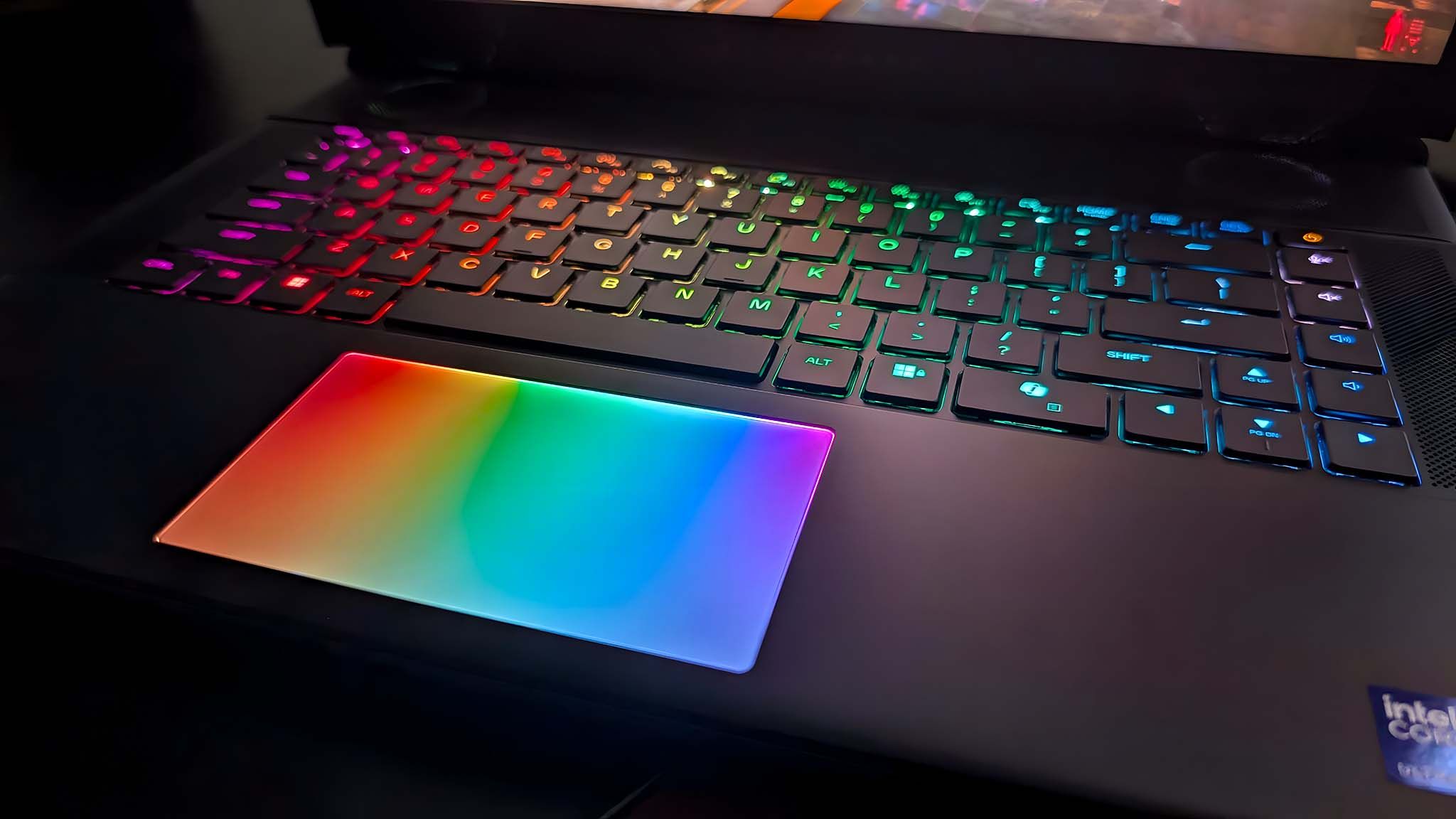 Closeup of the Alienware Area-51 16 Gaming Laptop's keyboard and RGB touchpad. 