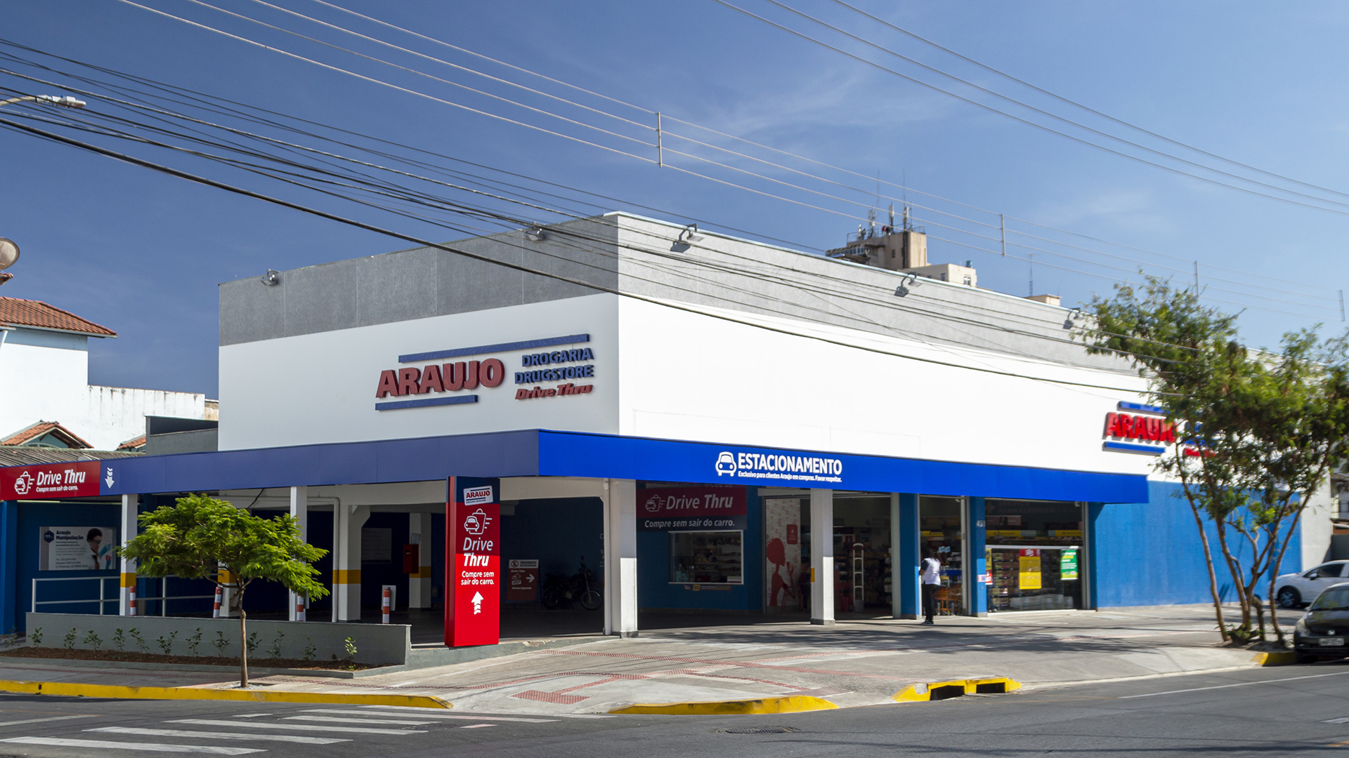 Minas Gerais. Brazil. August 22, 2022. New Araujo Drugstore branch in Belo Horizonte. Drugstore Araujo. Dark blue sky with clouds.