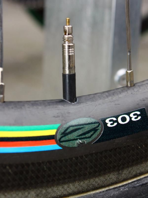 A bit of electrical tape keeps the valve stem from rattling inside the rim.