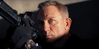 No Time To Die Daniel Craig glares intensely as he holds his gun