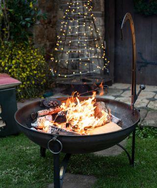 firepit lit outdoors in the winter