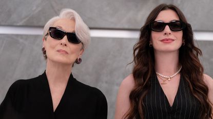 Miranda and Andy wearing sunglasses and half-looking up in The Devil Wears Prada 2