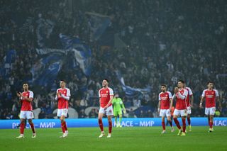 A general view as players of Arsenal look dejected as they acknowledge the fans after defeat to FC Porto during the UEFA Champions League 2023/24 round of 16 first leg match between FC Porto and Arsenal FC at Estadio do Dragao on February 21, 2024 in Porto, Portugal.