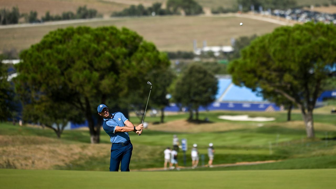 Rory McIlroy of Europe chips onto the 11th green during a practice round before the 2023 Ryder Cup at Marco Simone Golf and Country Club in Rome, Italy.