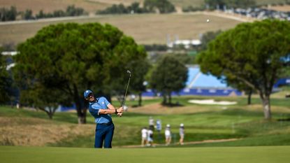 Rory McIlroy of Europe chips onto the 11th green during a practice round before the 2023 Ryder Cup at Marco Simone Golf and Country Club in Rome, Italy.