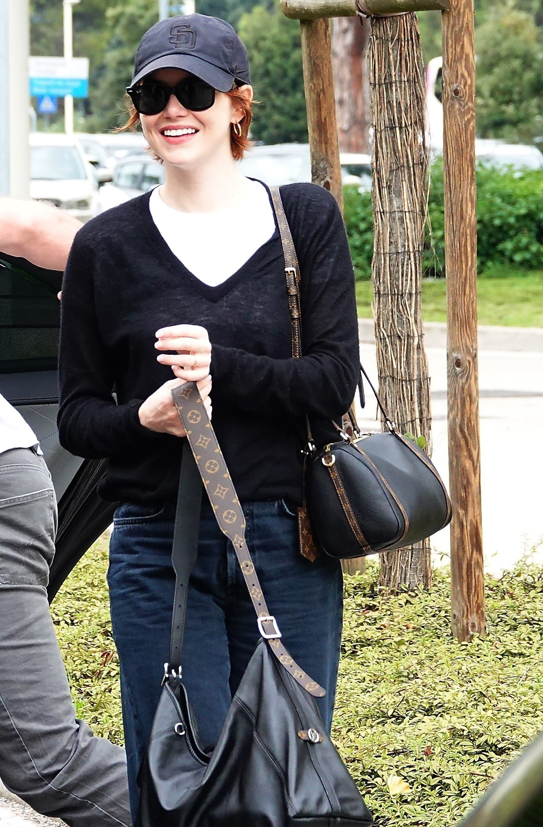 Emma Stone arrived at the Venice Film Festival in the toe-ring sandal trend and two Louis Vuitton bags