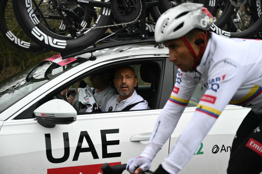 Matxin Joxean Fernandez (L), Sports Manager of team UAE speaks to rider Jhonatan Manuel Narvaez Prado during the Milan - Sanremo one-day classic cycling race, on March 22, 2025. (Photo by Marco BERTORELLO / AFP) (Photo by MARCO BERTORELLO/AFP via Getty Images)