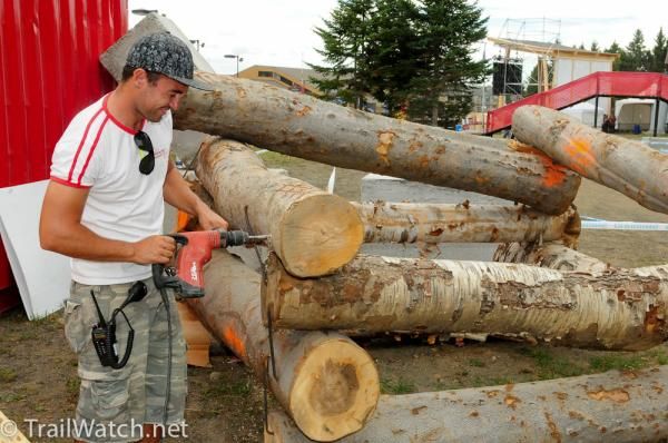 A worker helps prepare part to the trials course.