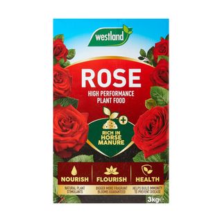 Box of Westland rose food with pictures of roses on the front, alongside information on ingredients and the use of the product