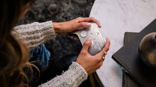 Woman holding Xbox wireless controller