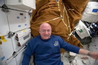 STS-134 commander Mark Kelly is surrounded by cargo bags on board the middeck of space shuttle Endeavour while docked with the International Space Station in May 2011.