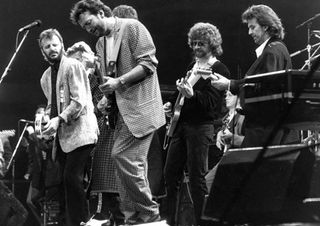 From left, Ringo Starr, Eric Clapton, Jeff Lynne and George Harrison perform at the Prince's Trust Concert at London's Wembley Arena on June 5, 1987.