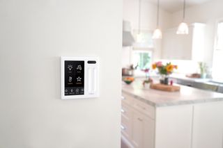 Brilliant Home Control installed in front of a kitchen setting 