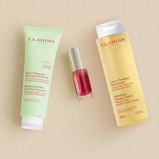 Three Clarins beauty products on a surface