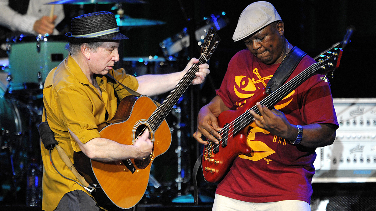 US singer and songwriter Paul Simon (L) performs with bass guitarist Bakithi Kumalo on the Auditorum Stravinski stage during the 42nd Montreux Jazz Festival on July 9, 2008 in Montreux. The festival runs from July 4 to July 19.  AFP PHOTO / FABRICE COFFRINI (Photo by FABRICE COFFRINI / AFP) (Photo by FABRICE COFFRINI/AFP via Getty Images)