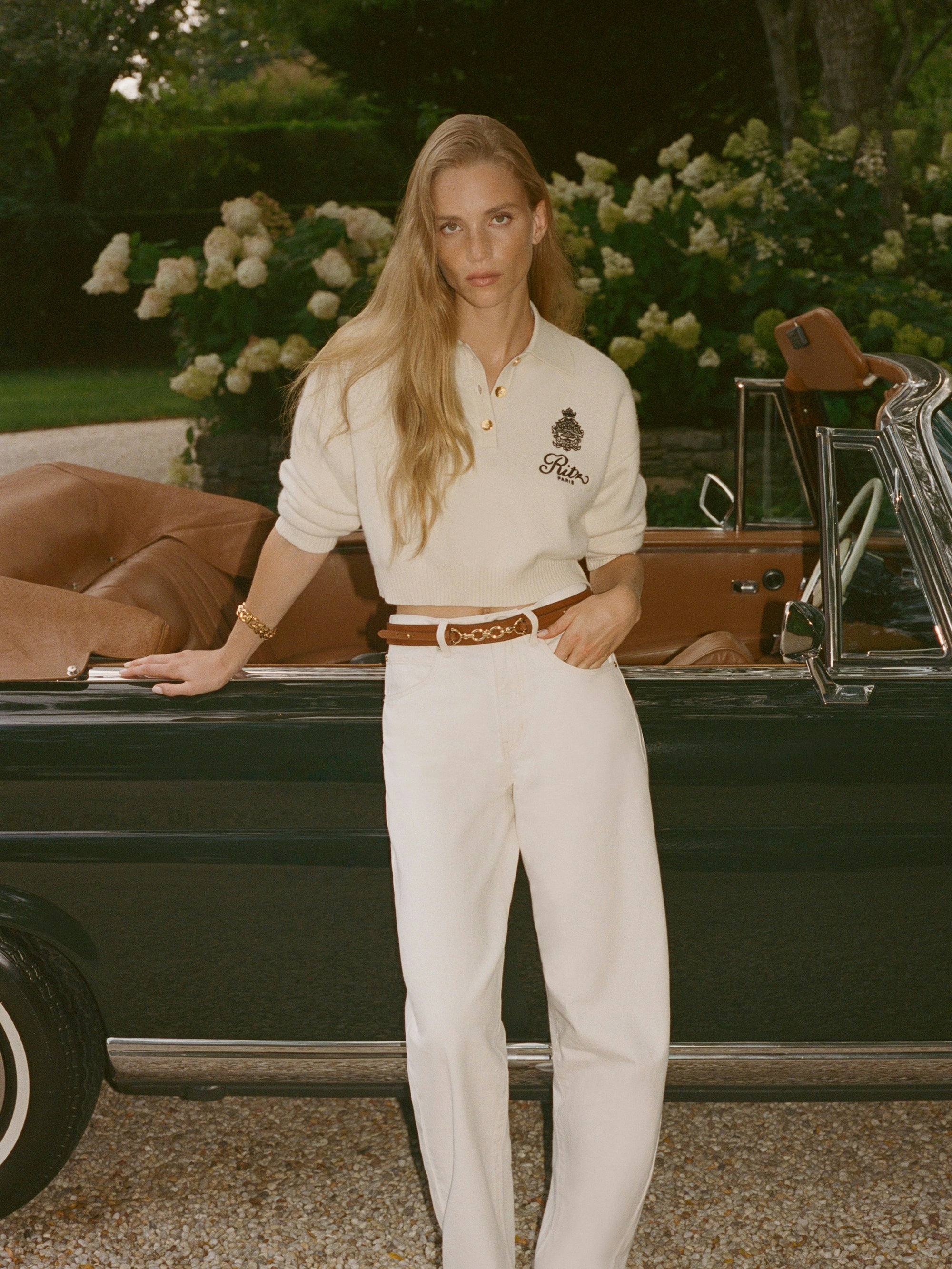 A series of models wear hotel-branded sweatshirts, jumpers, polo shirts, and more inspired by the glitz and glam of The Ritz Paris.