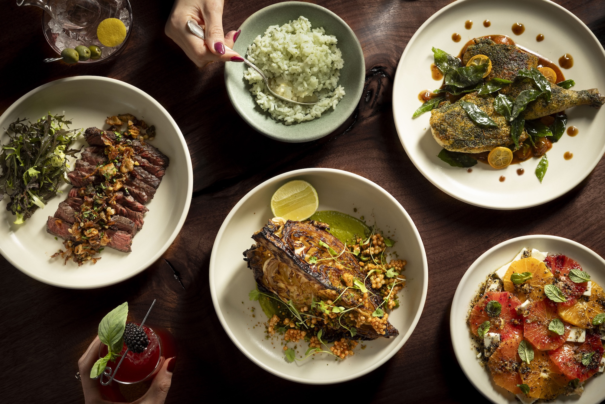 an assortment of plates featuring food like roast fish and tomatoes
