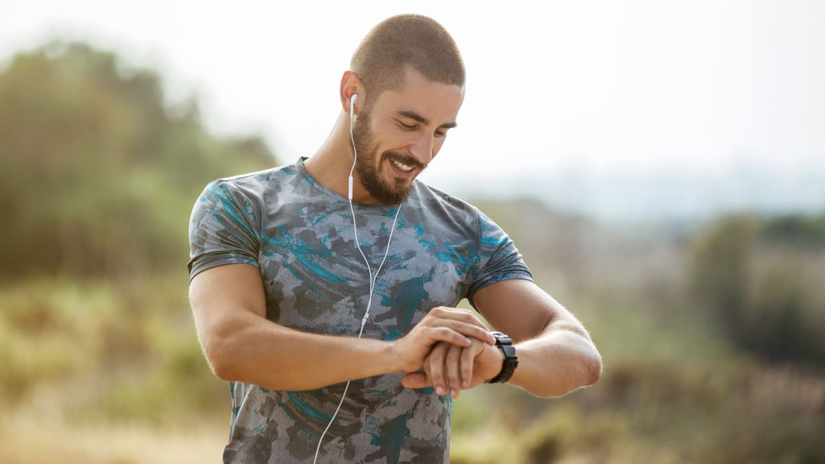 Man checking GPS watch during workout