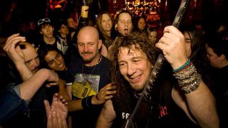 Lips from Anvil surrounded by fans at a club gig