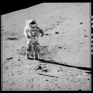 Apollo 17 astronaut Gene Cernan preparing to collect samples 73001 and 73002.