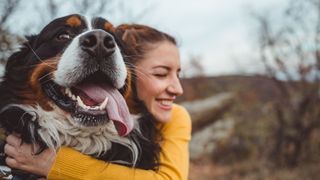 Woman hugging dog