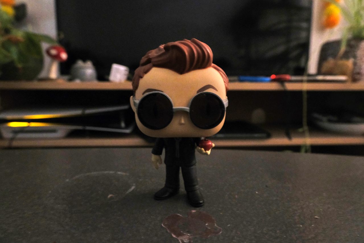 A Funko Pop figure of Crowley from Good Omens, taken on a Fujifilm X-M5 mirrorless vlogging camera