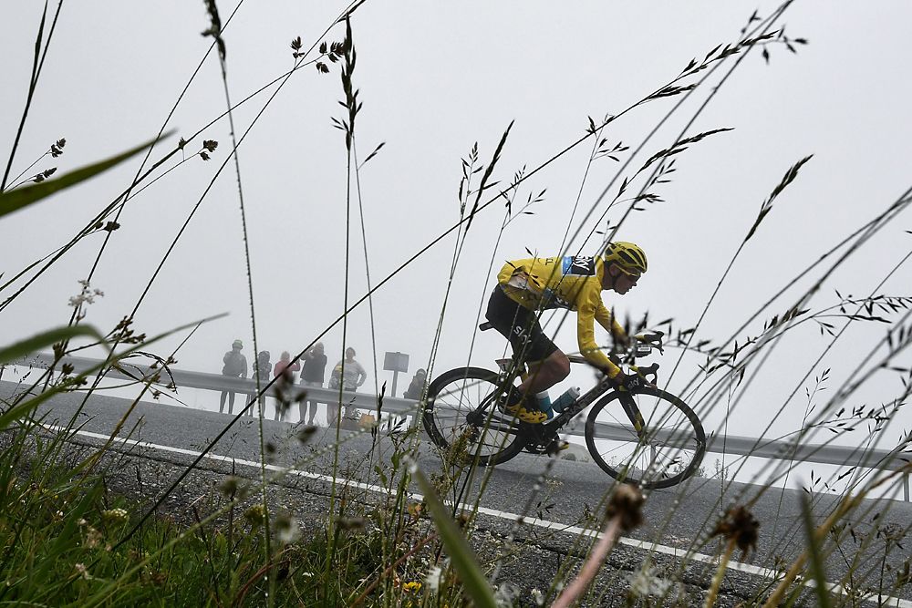 Chris Froome (Team Sky) descending in the yellow jersey