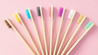 a set of wooden toothbrushes
