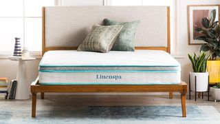 Linenspa Hybrid Mattress place don a wooden bedframe