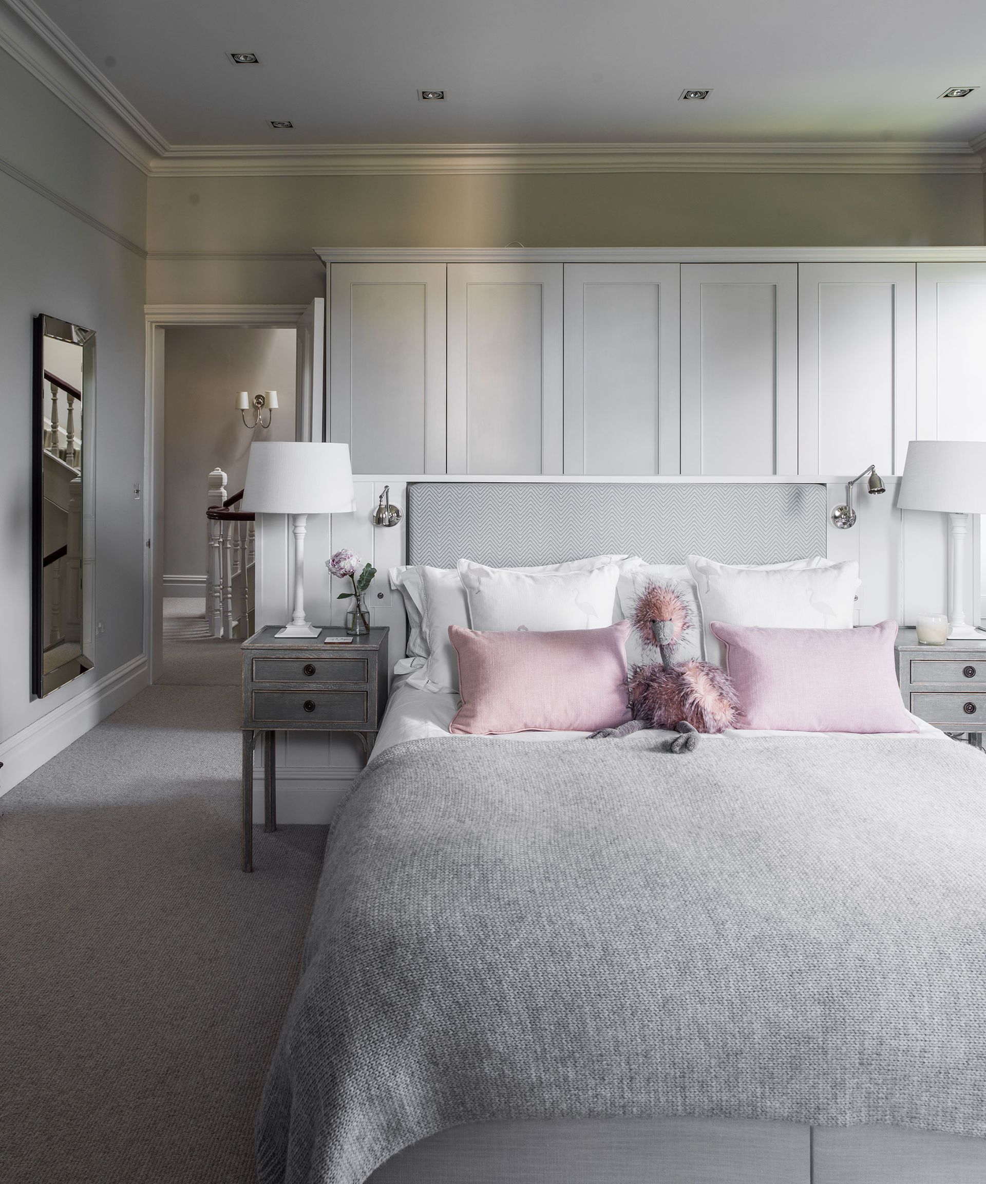 Bedroom ceiling light with LED spotlights and fitted cabinetry