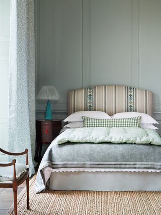 pale blue and patterned green bedroom