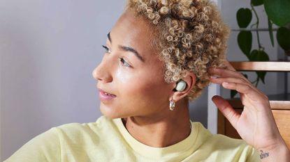 Samsung Galaxy Buds2 review: image shows woman wearing Samsung Galaxy Buds2