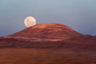 The first full moon of 2018, a supermoon, rises over Cerres Amazones in Chile's Atacama Desert - the future home of the European Extremely Large Telescope overseen by the European Southern Observatory - on Jan. 1, 2018.