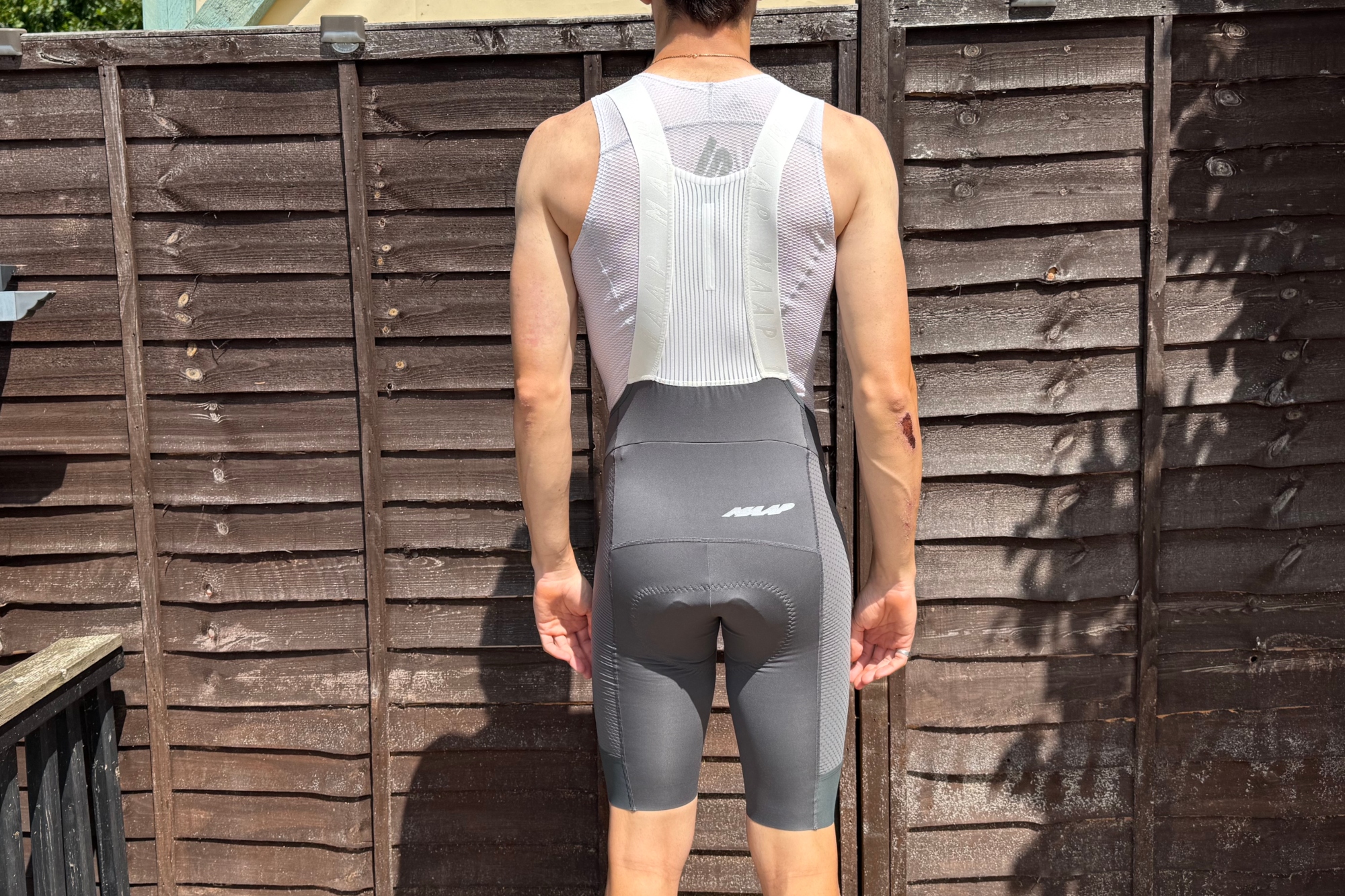 Andy Turner wares the MAAP Pro bib shorts 2.0 with his back to the camara