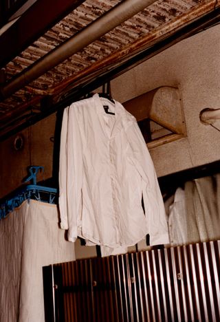 White shirt hanging in the street, from SIGNS, by Lucie Rox