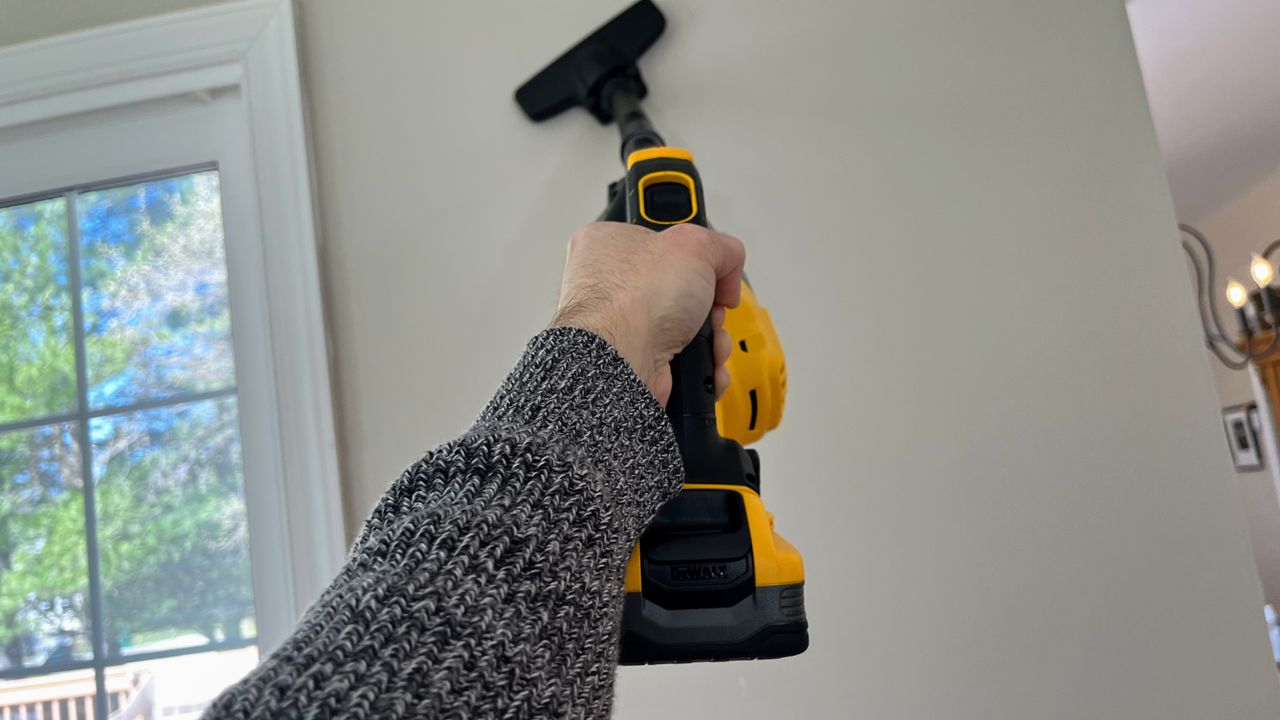 DeWalt 20V Cordless Dry Hand Vacuum being tested in writer's home