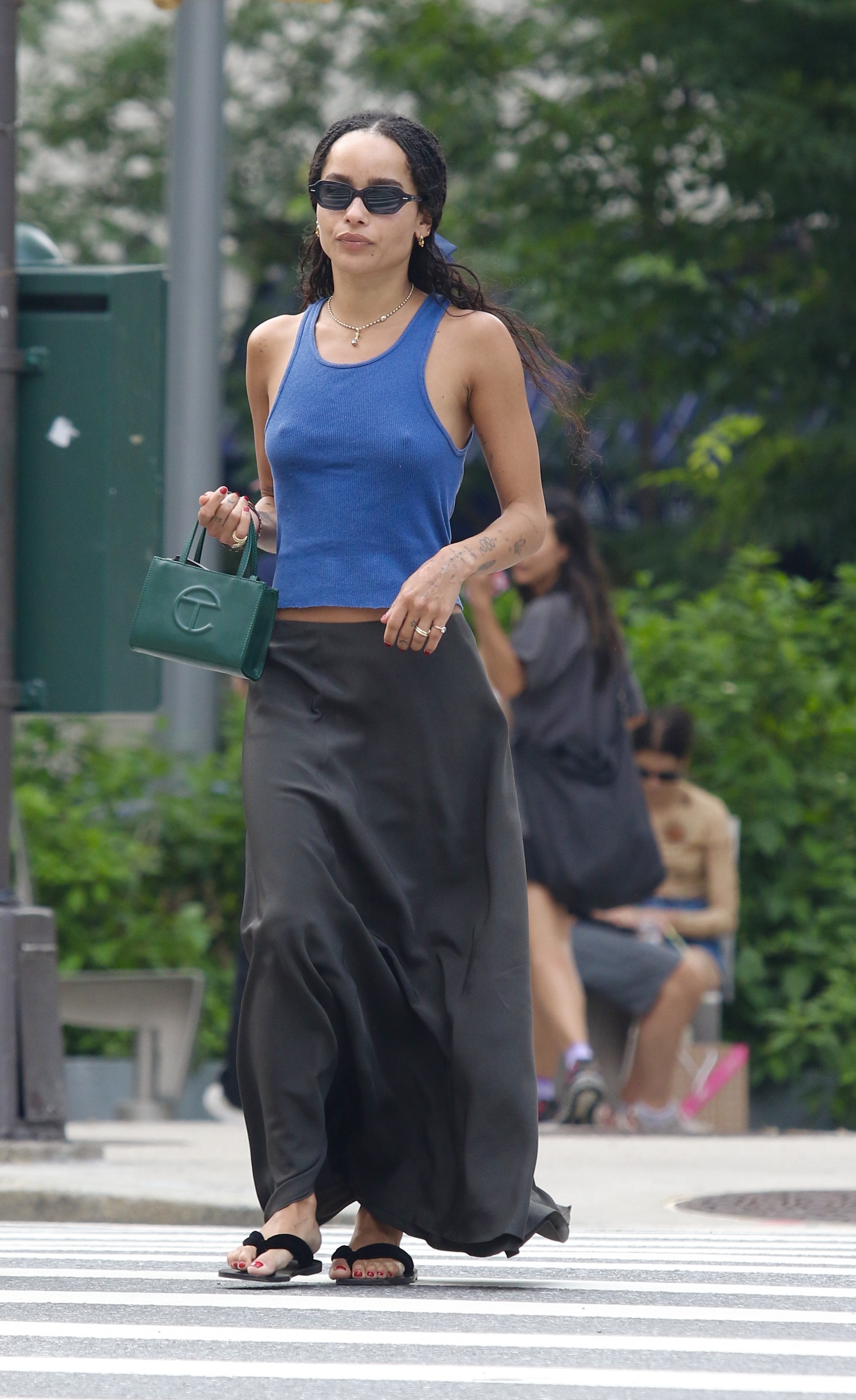 An image of Zoe Kravitz wearing the best flip flops.