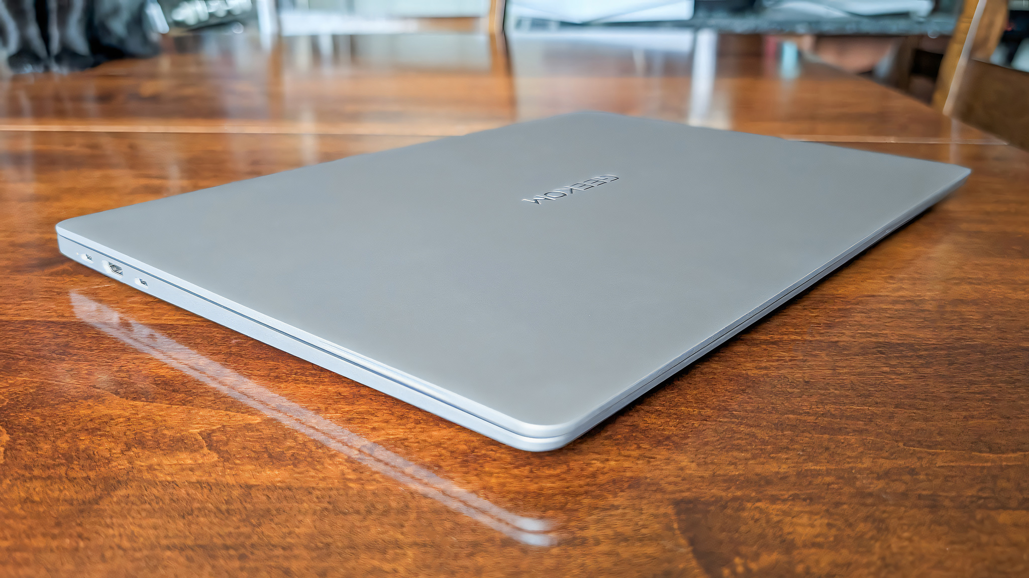 Geekom GeekBook X16 Pro closed and on a table.