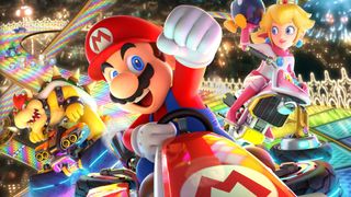 best Nintendo Switch games: Mario in his kart, raising a fist in victory, princess Peach and Bowser coming in behind him