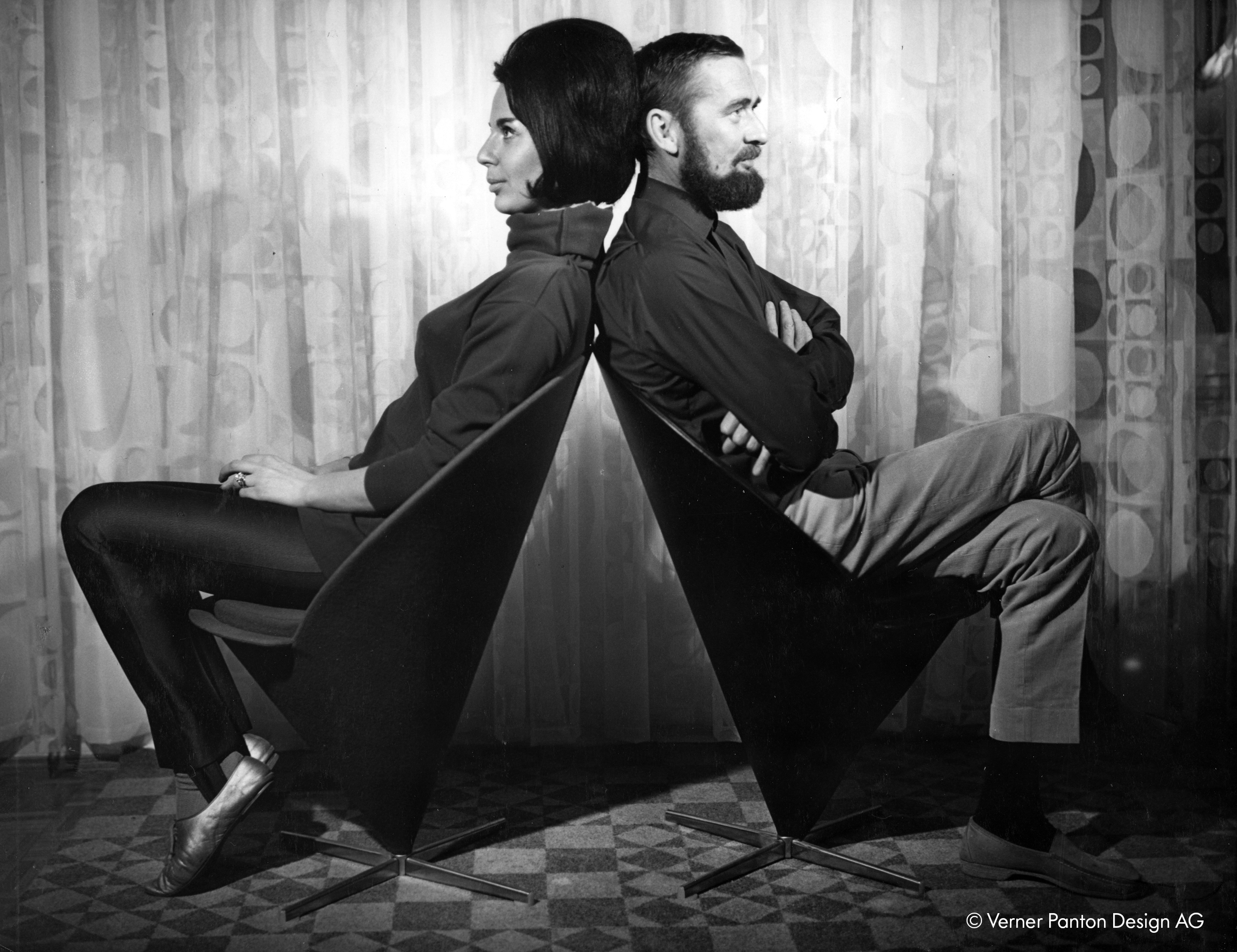 Black and white photograph of Marianne and Verner Panton in the Cone Chairs
