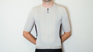 Maap Alt_Road jersey being worn by a white male against a white wall