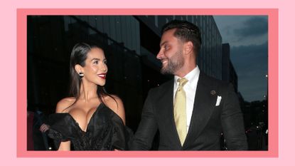 Ekin-Su and Davide smile at each other as they're seen attending the National Television Awards 2022 at OVO Arena Wembley on October 13, 2022 in London, England. On a pink background