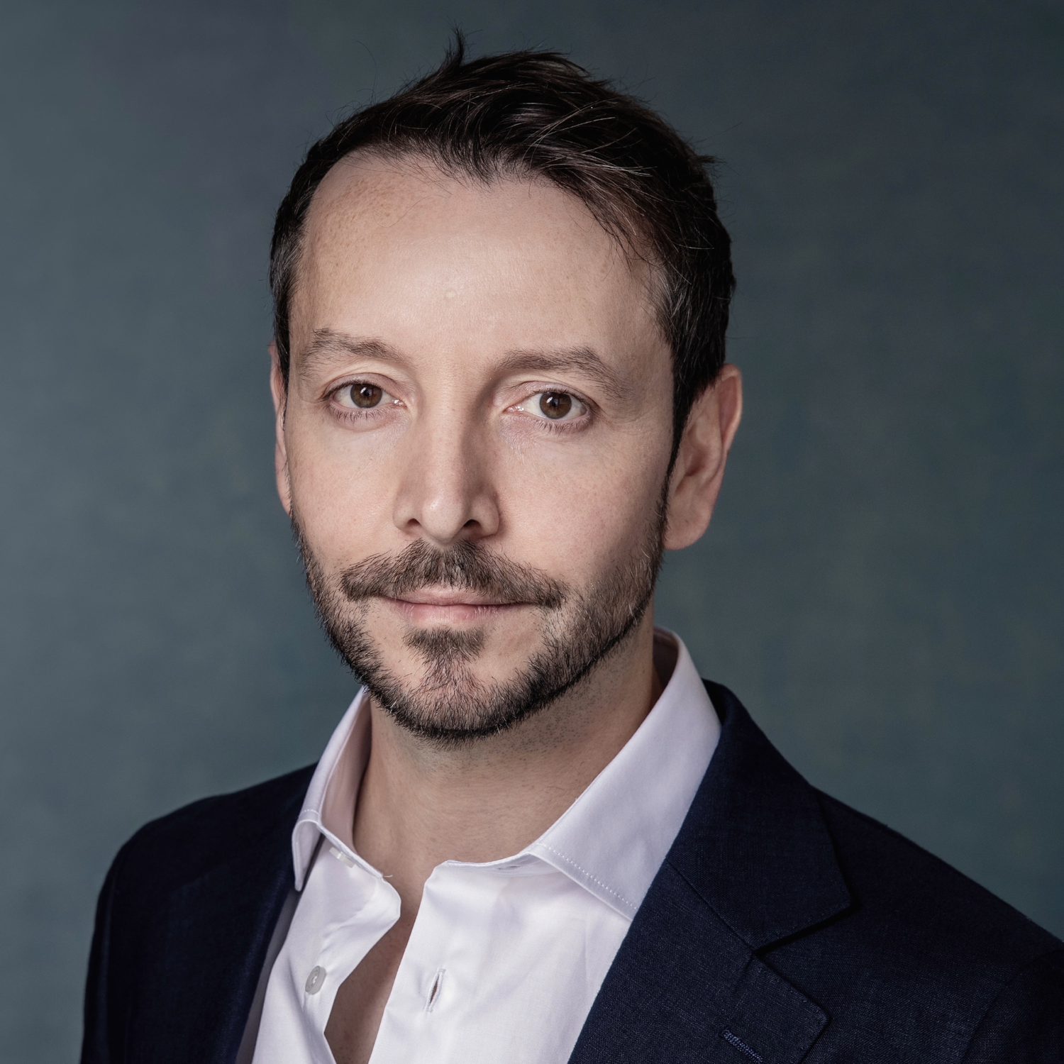 A headshot of David Wickett