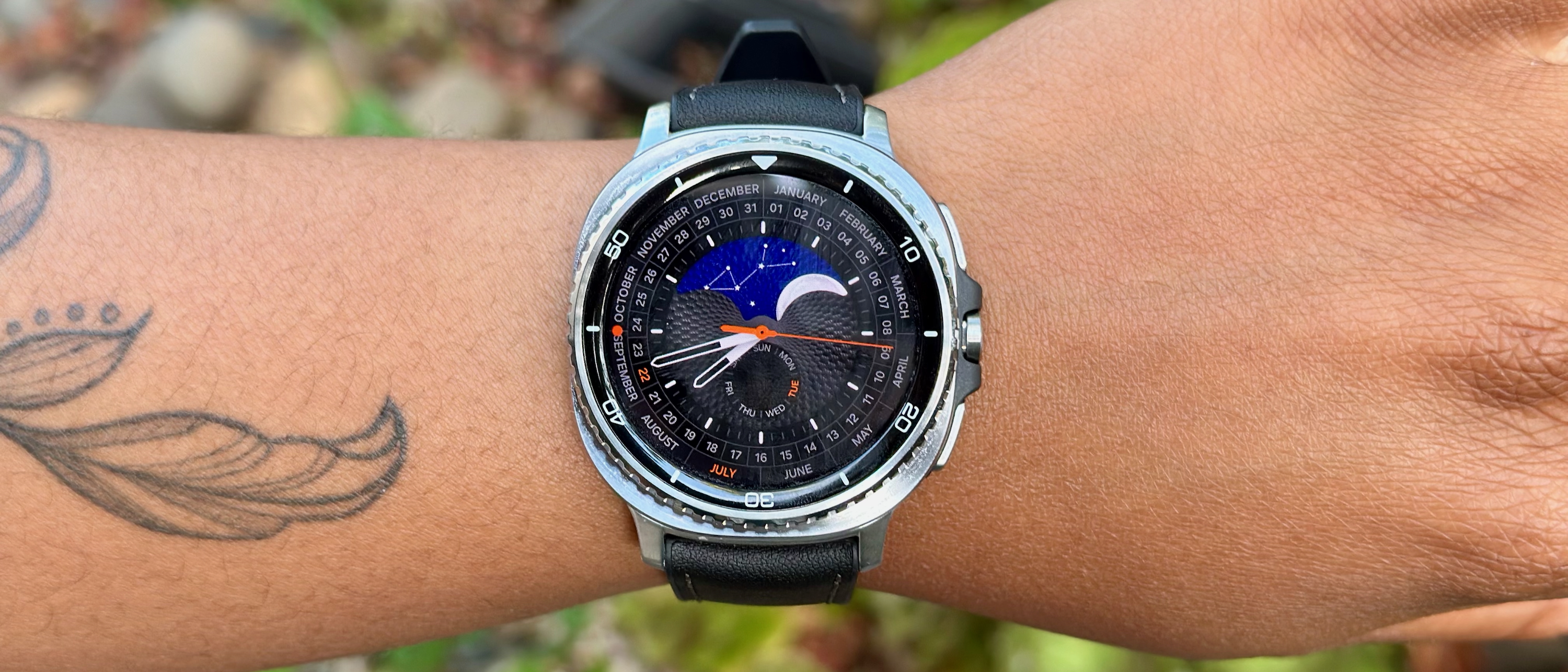 A close-up of the Samsung Galaxy Watch 8 Classic on a woman's wrist showing the Heritage Classic watch face.
