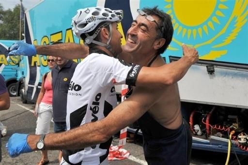Carlos Sastre and his mechanic share a hug before the defending Tour champion rolls out for a training ride.